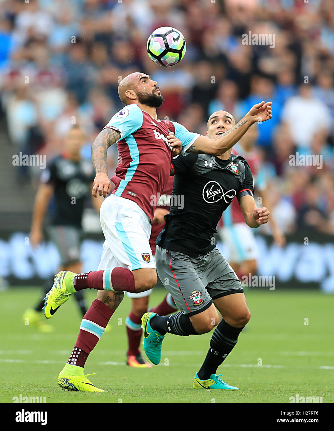 West Ham United's Simone Zaza (left) and Southampton's Oriol Romeu ...