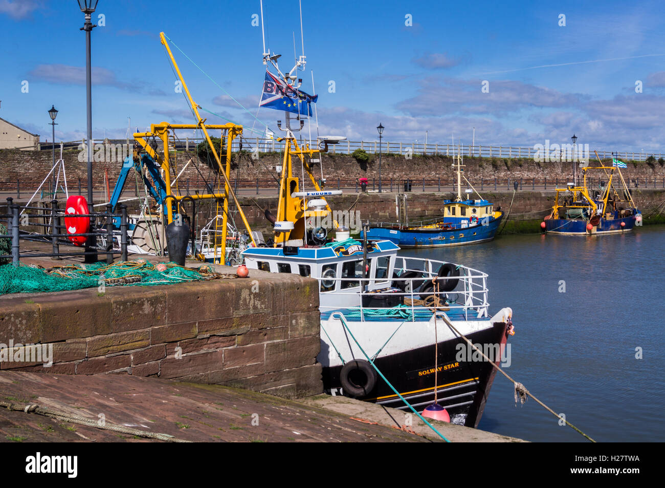 A trawler flying a BREXIT flag in support of UK exit from EU, Elizabeth Dock, Maryport, Cumbria, England Stock Photo