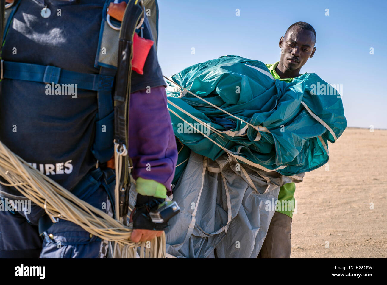 Parachute packer take away skydiving equipment from the jumping field