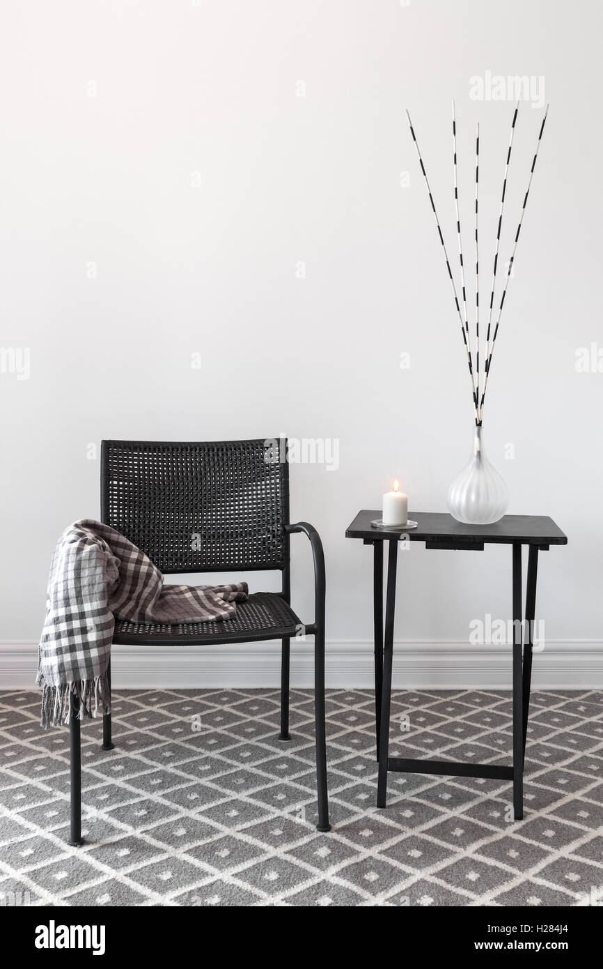 Home decor. Armchair and table with decorations Stock Photo Alamy