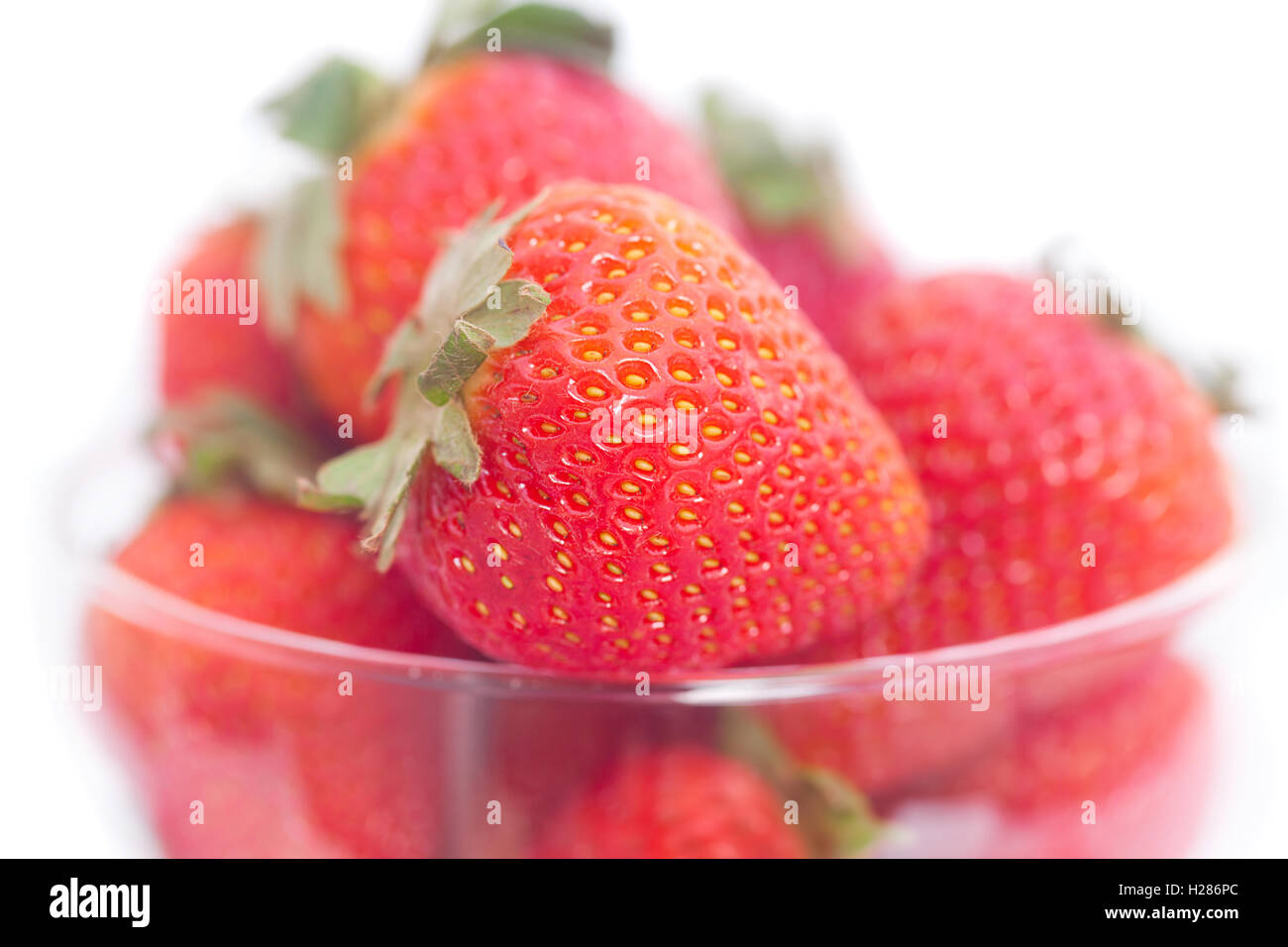 strawberry in a glass bowl isolated on white Stock Photo - Alamy