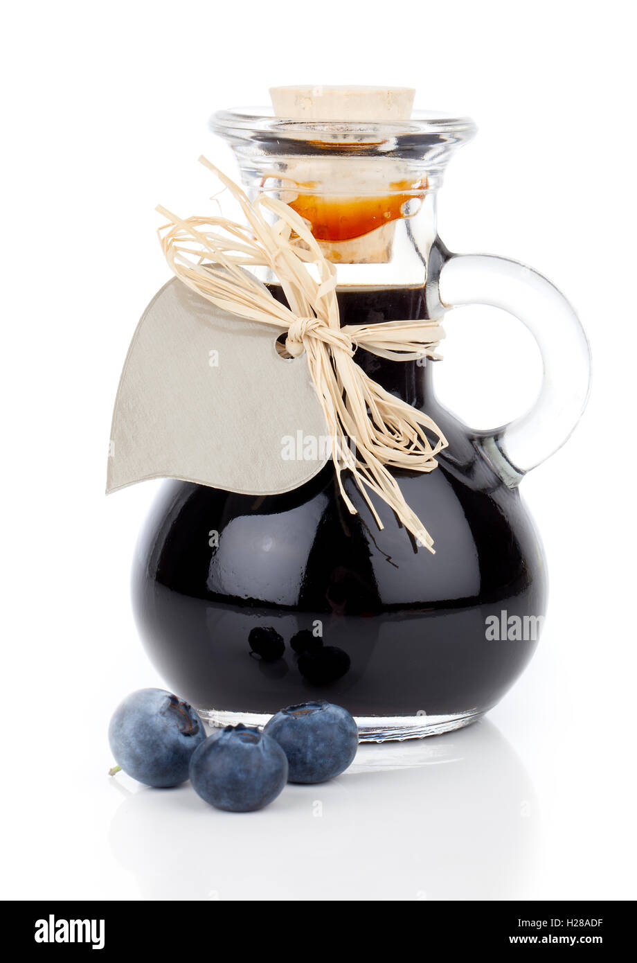 blueberry syrup in glass bottle or mixture, with heart label. on Stock