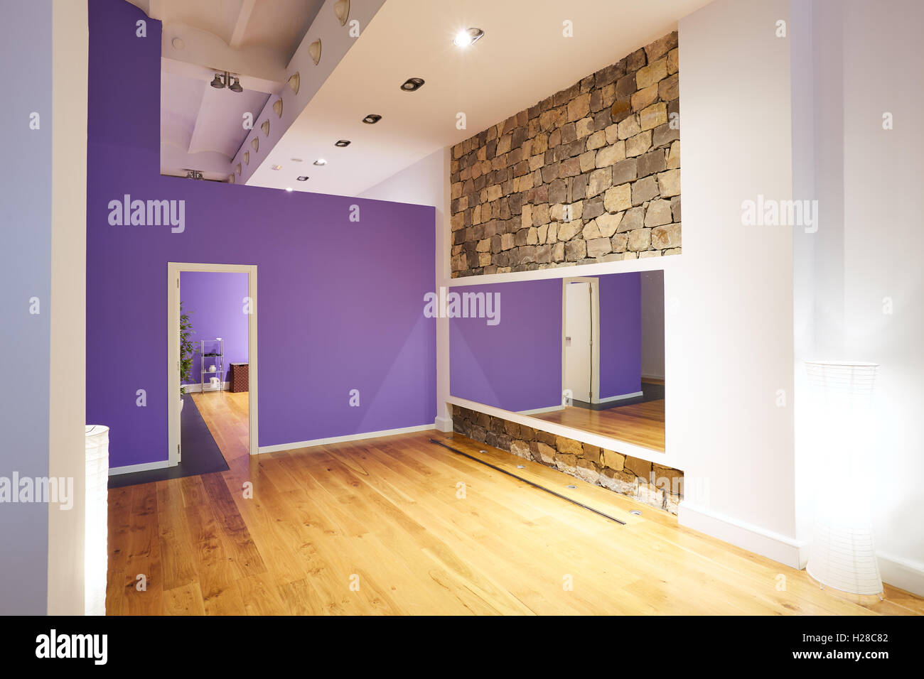 Gym indoor with wooden floor mirror and stone wall Stock Photo