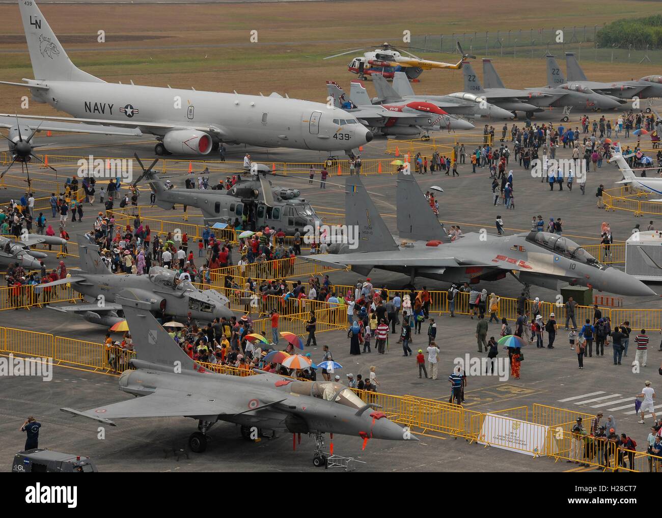 Crowds gather to view U.S. military aircraft at the Langkawi International Maritime and Aerospace Exhibition March 21, 2015 in Langkawi, Malaysia. Stock Photo