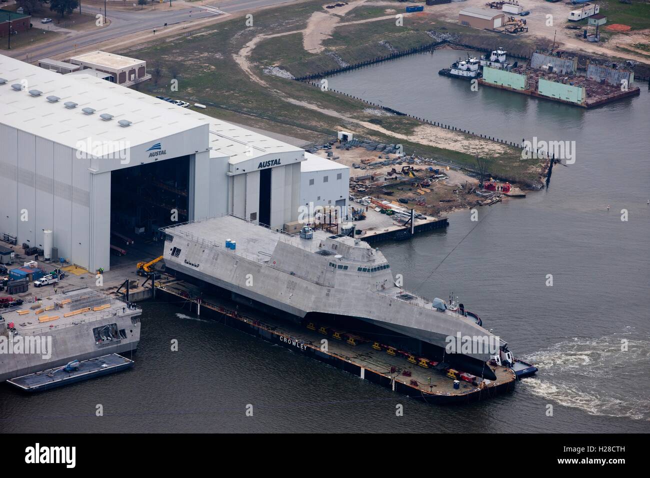 An aerial view of the new Navy Independence-class littoral combat ship USS Gabrielle Giffords during its launch sequence at the Austal USA shipyard February 24, 2015 in Mobile, Alabama. Stock Photo