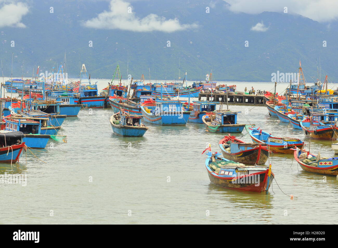 Nha Trang, Vietnam - October 5, 2011: Fishing boats are mooring in a ...