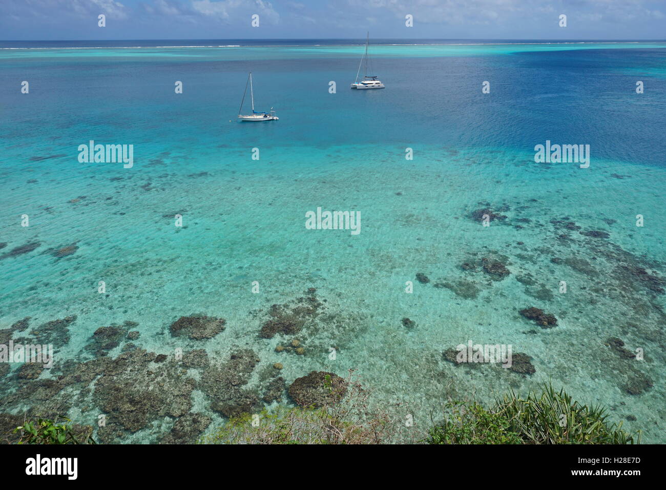 Aerial view over the lagoon with two boats anchored, south Pacific ocean, Huahine island, French Polynesia Stock Photo