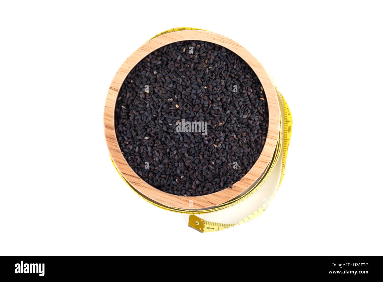 black sesame seeds in wooden bowl isolated on white background Stock ...