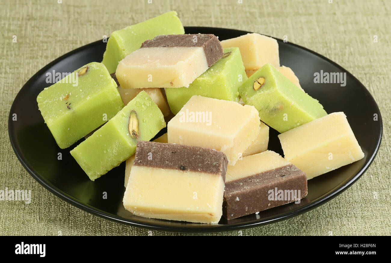 selection of fresh creamy barfi plain chocolate and pistachio Stock Photo