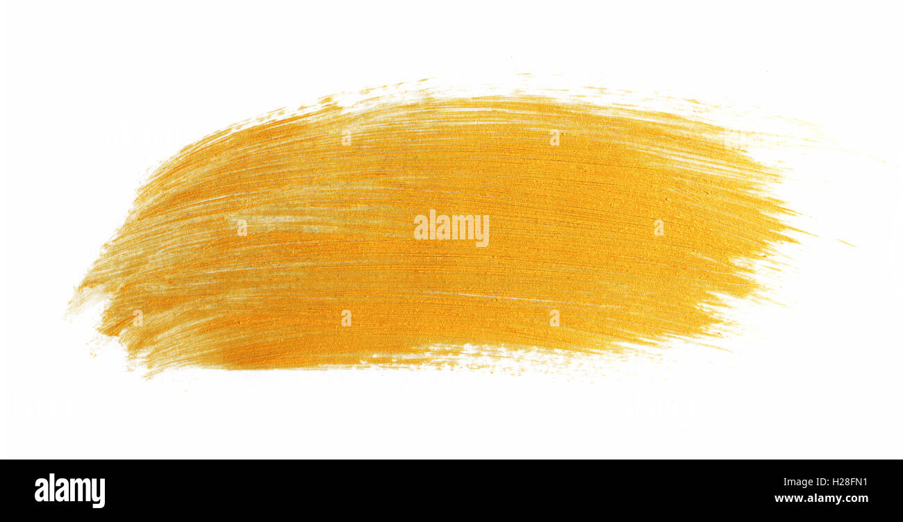 Paint brush stroke texture golden acrylic  isolated on a white background Stock Photo