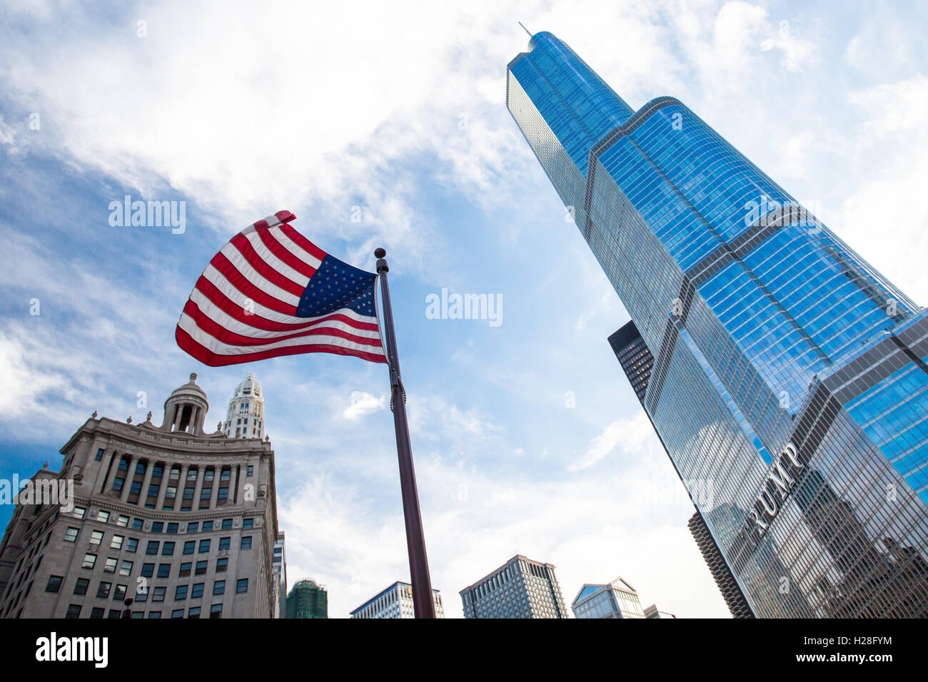 Trump Tower in downtown Chicago with the USA flag flying nearbny on a hot summer's day Stock Photo