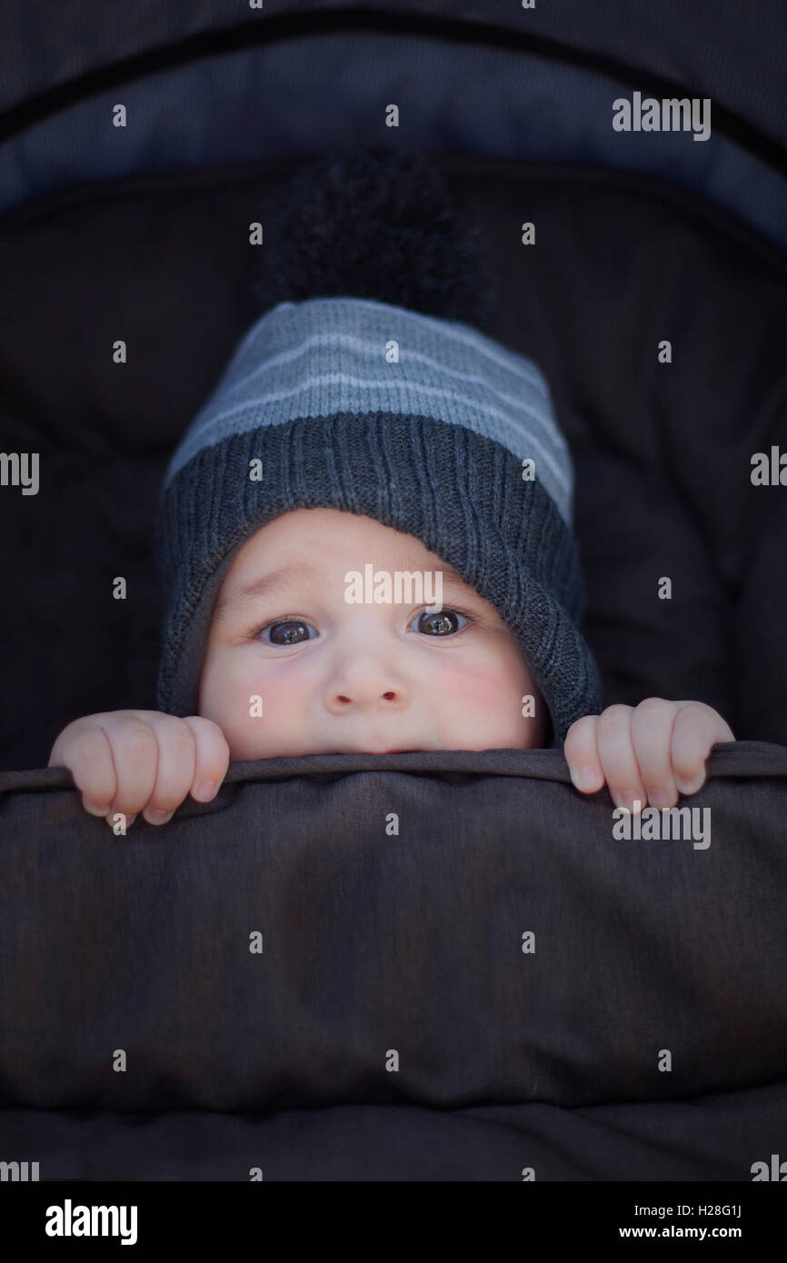 Winter baby keeping warm Stock Photo