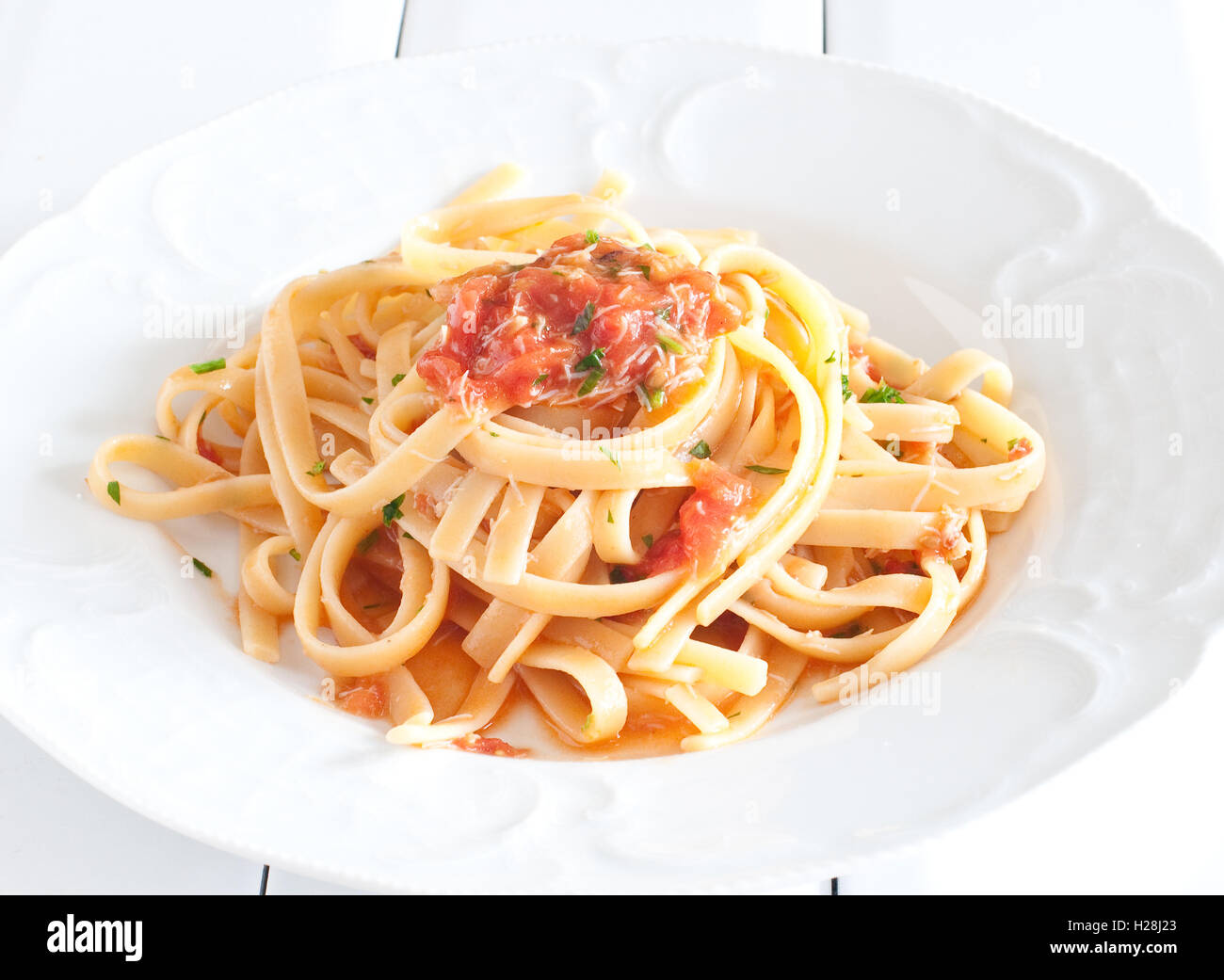 noodles with crab sauce and chopped tomatoes astice bolognese delicious fork italian pasta italian recipe lasagna maccheroni oct Stock Photo