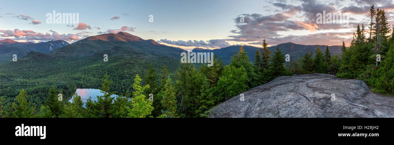 A sunset panoramic view from the summit of Mount Jo, overlooking Heart Lake, Mt. Colden, and Algonquin and Wright Peaks. Stock Photo