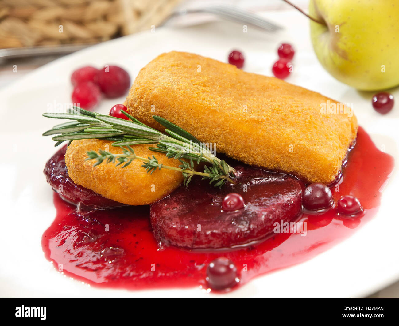 Fried cheese with cranberry sauce and rosemary leaves Stock Photo Alamy