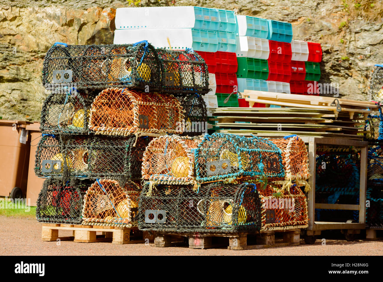 Mollosund, Sweden - September 9, 2016: Environmental documentary of lobster traps on pallets in fishing harbor area. Stock Photo