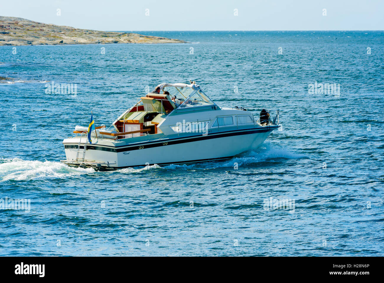 Mollosund, Sweden - September 9, 2016: Environmental documentary of motorboat leaving for a trip in the archipelago. Stock Photo