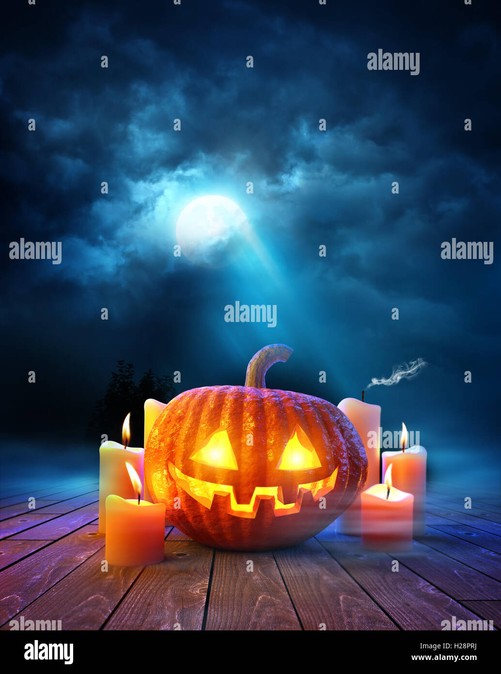 Halloween night, Jack O Lantern pumpkin with glowing candles on a ...