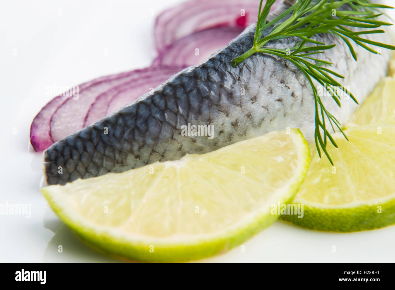 Fillet herring with onion and lemon Stock Photo Alamy