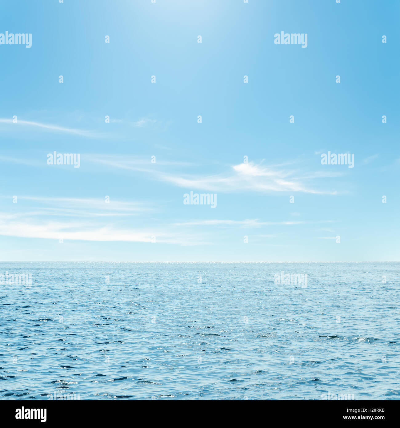 Blue sky with clouds over beach hi-res stock photography and images - Alamy