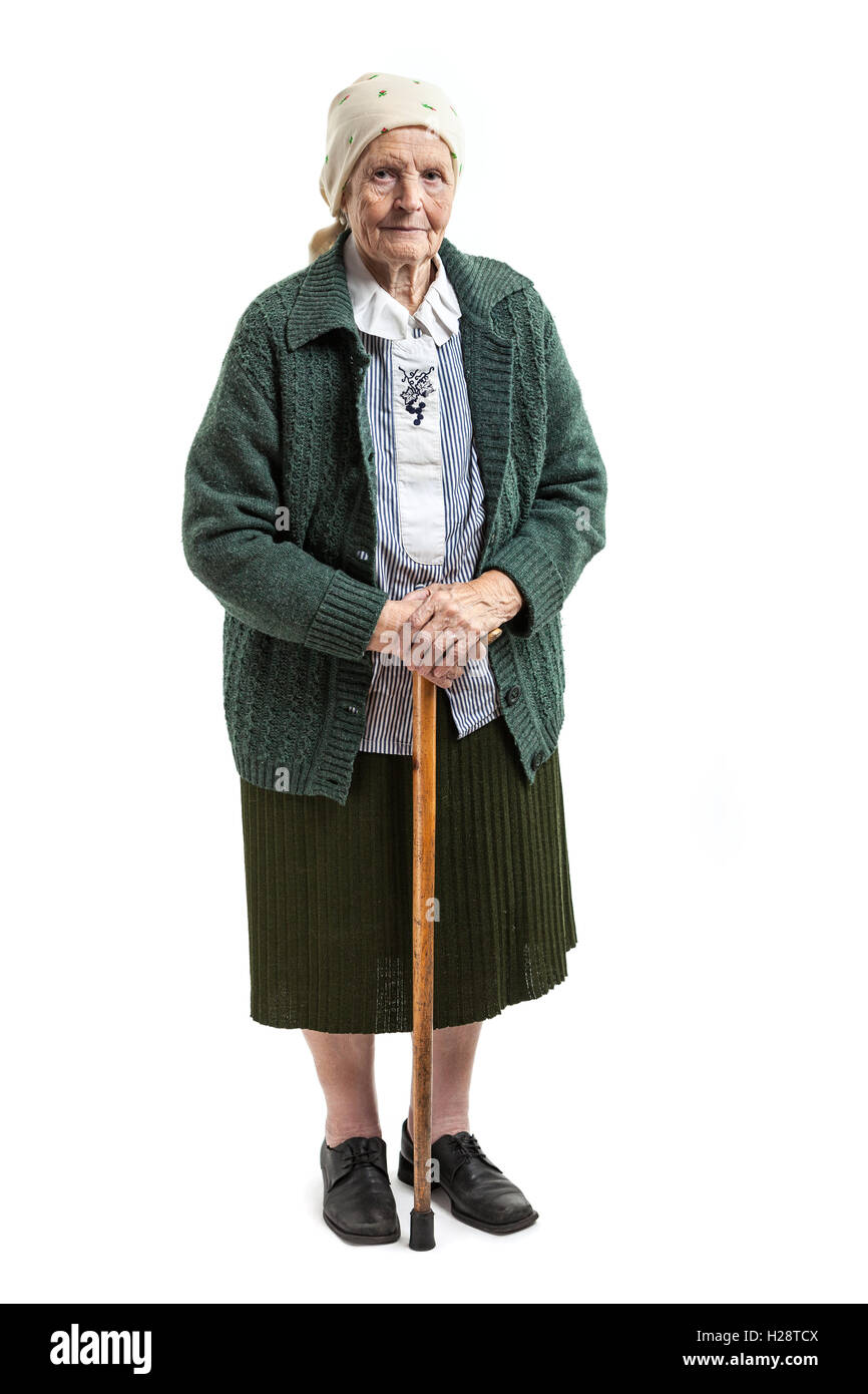 Old woman with a cane over white background Stock Photo