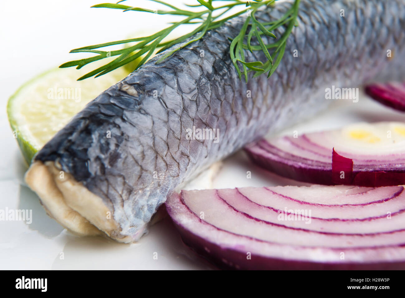 Fillet herring with onion and lemon Stock Photo Alamy