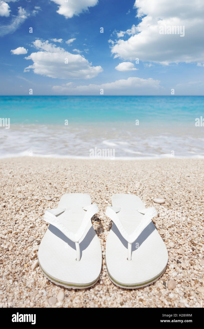 Flip flops on the beach Stock Photo - Alamy