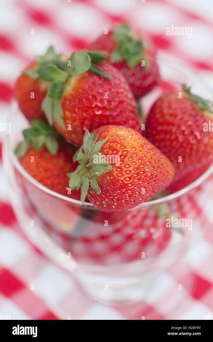 strawberry in a glass bowl on checkered fabric Stock Photo - Alamy