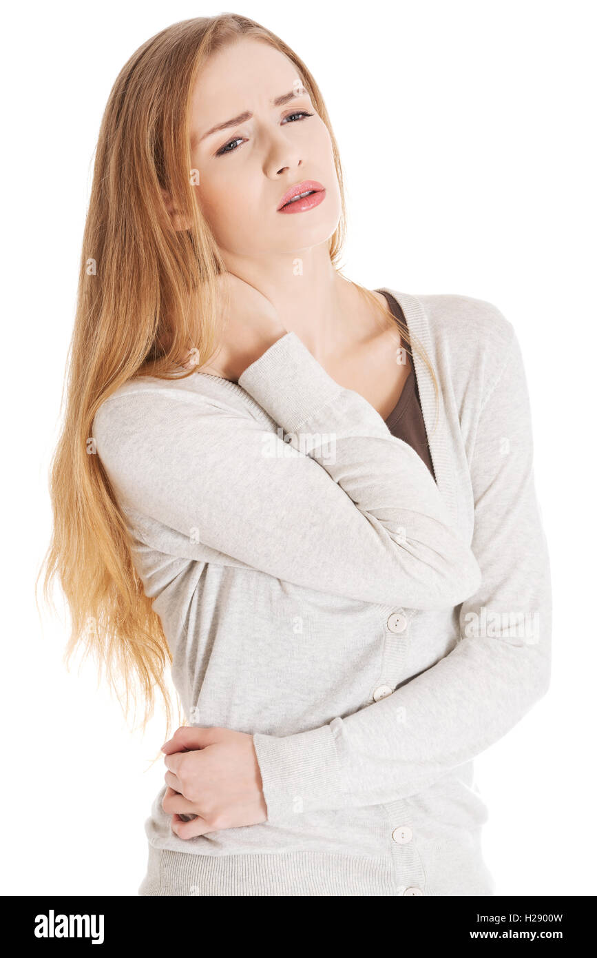 Beautiful casual woman is touching her neck Stock Photo - Alamy
