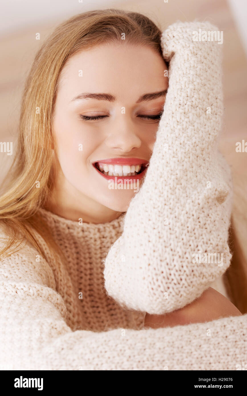 Beautiful caucasian woman is sitting on wooden floor Stock Photo - Alamy