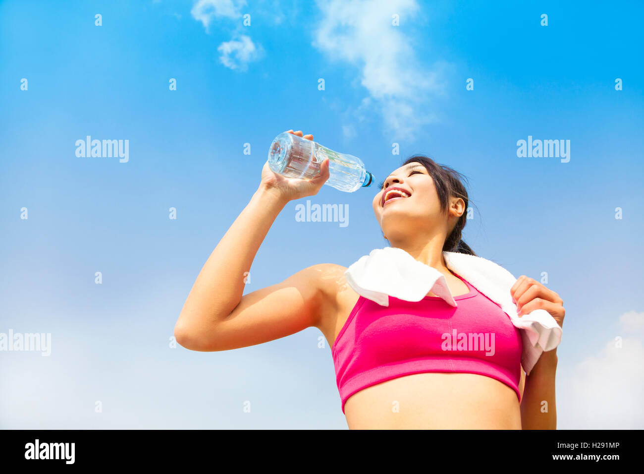 Young woman drinking water after fitness exercise Stock Photo Alamy