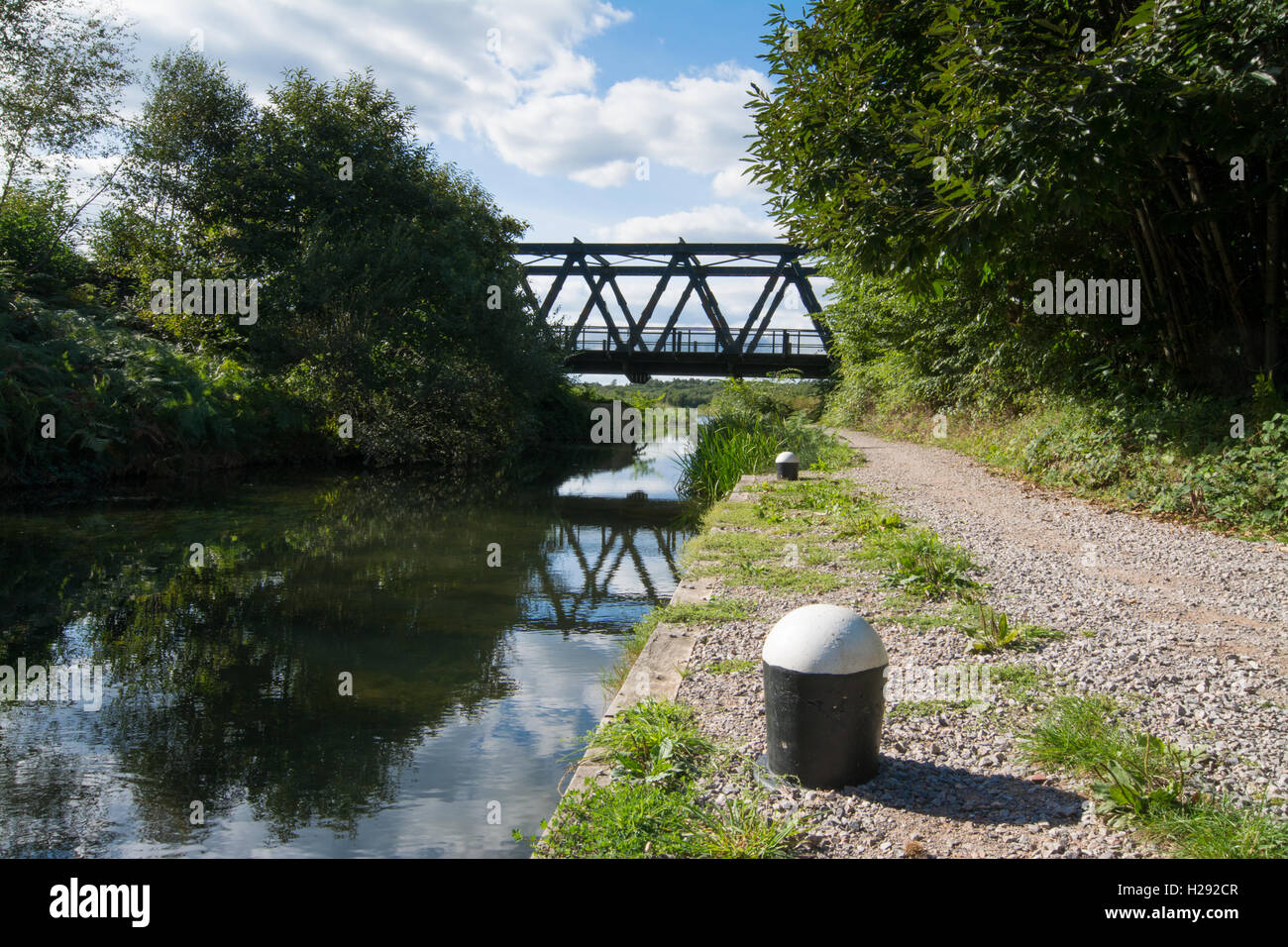 Eelmoor Bridge reflected in the Basingstoke Canal near Farnborough, Hampshire, England Stock Photo