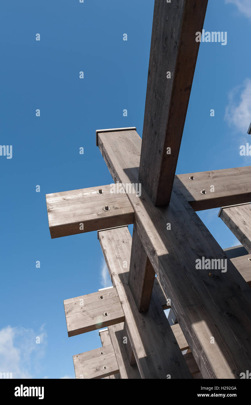 Weathered pine joists arranged as pergola joints intersected cross corner joints criss cross corner timber Stock Photo