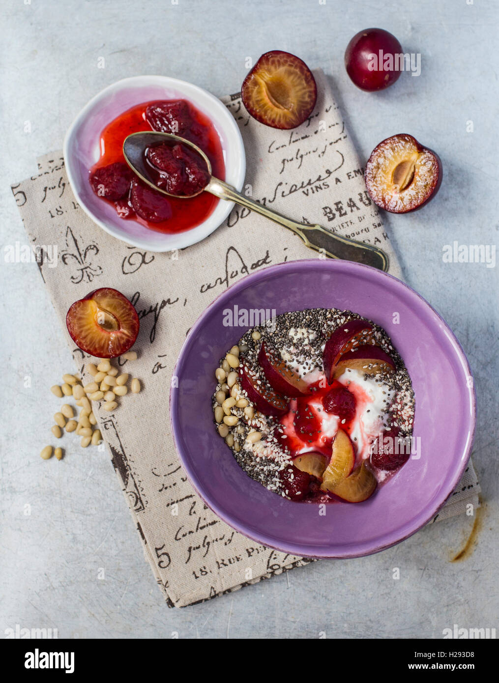 Yogurt with berries and nutritious seeds shot from above Stock Photo