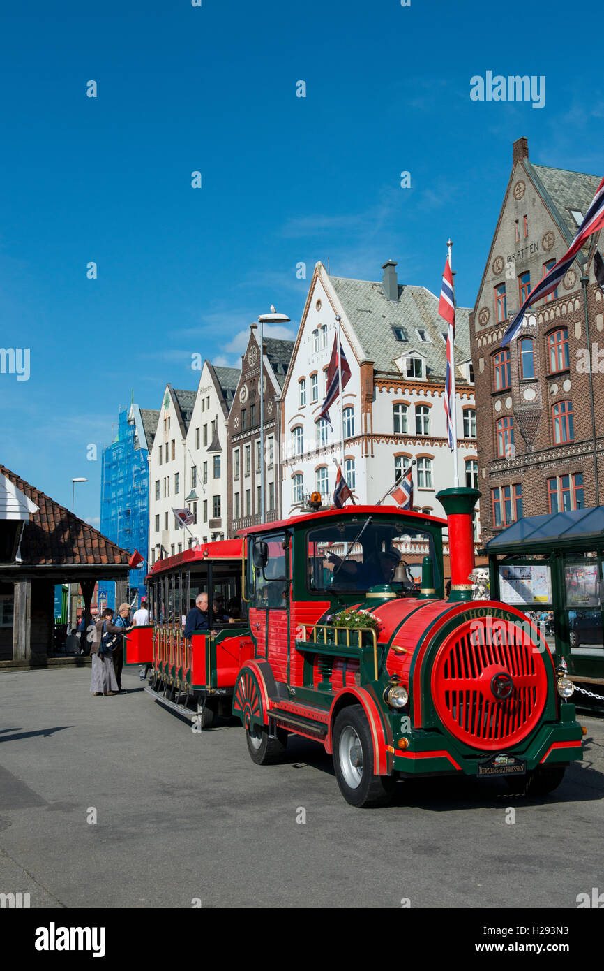 Bergen, Norway's second largest city. Bryggen (The Wharf), historic waterfront dating back to the 12th century. Tourist train. Stock Photo
