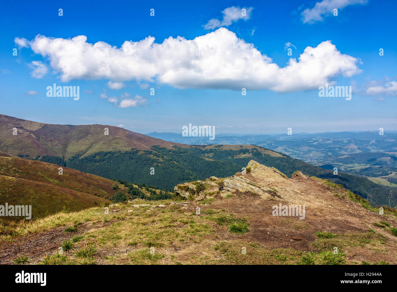 early autumn mountain landscape under the blue sky with clouds in ...