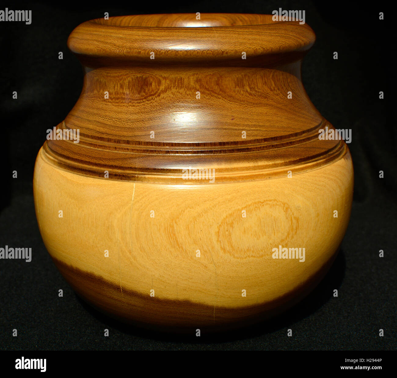 Wooden pot for interior decoration. Beautiful hand crafted wooden pot. Stock Photo