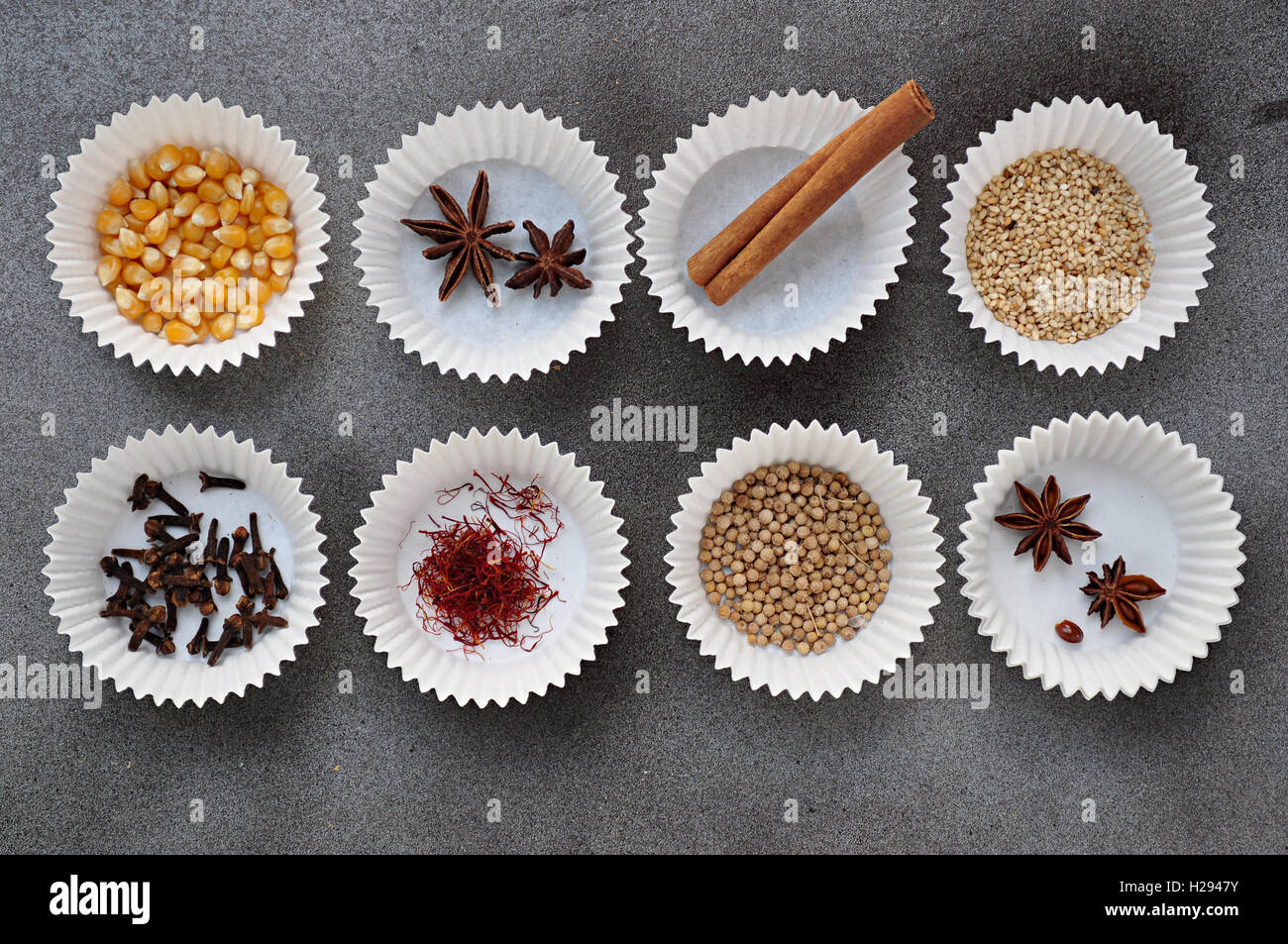 paper cupcake trays with spices end seeds Stock Photo Alamy