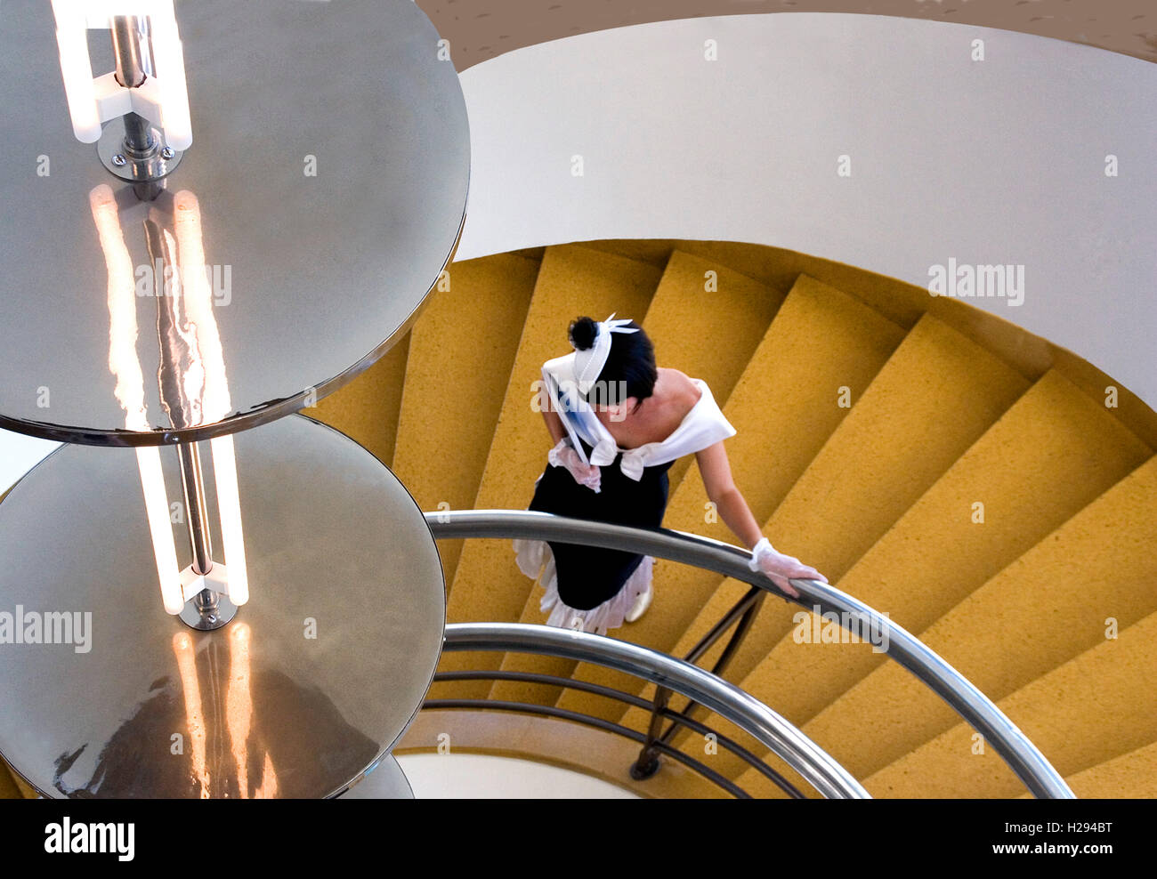 Stairway in De la Warr Pavilion, Bexhill on Sea,  with model in costume of the era Stock Photo