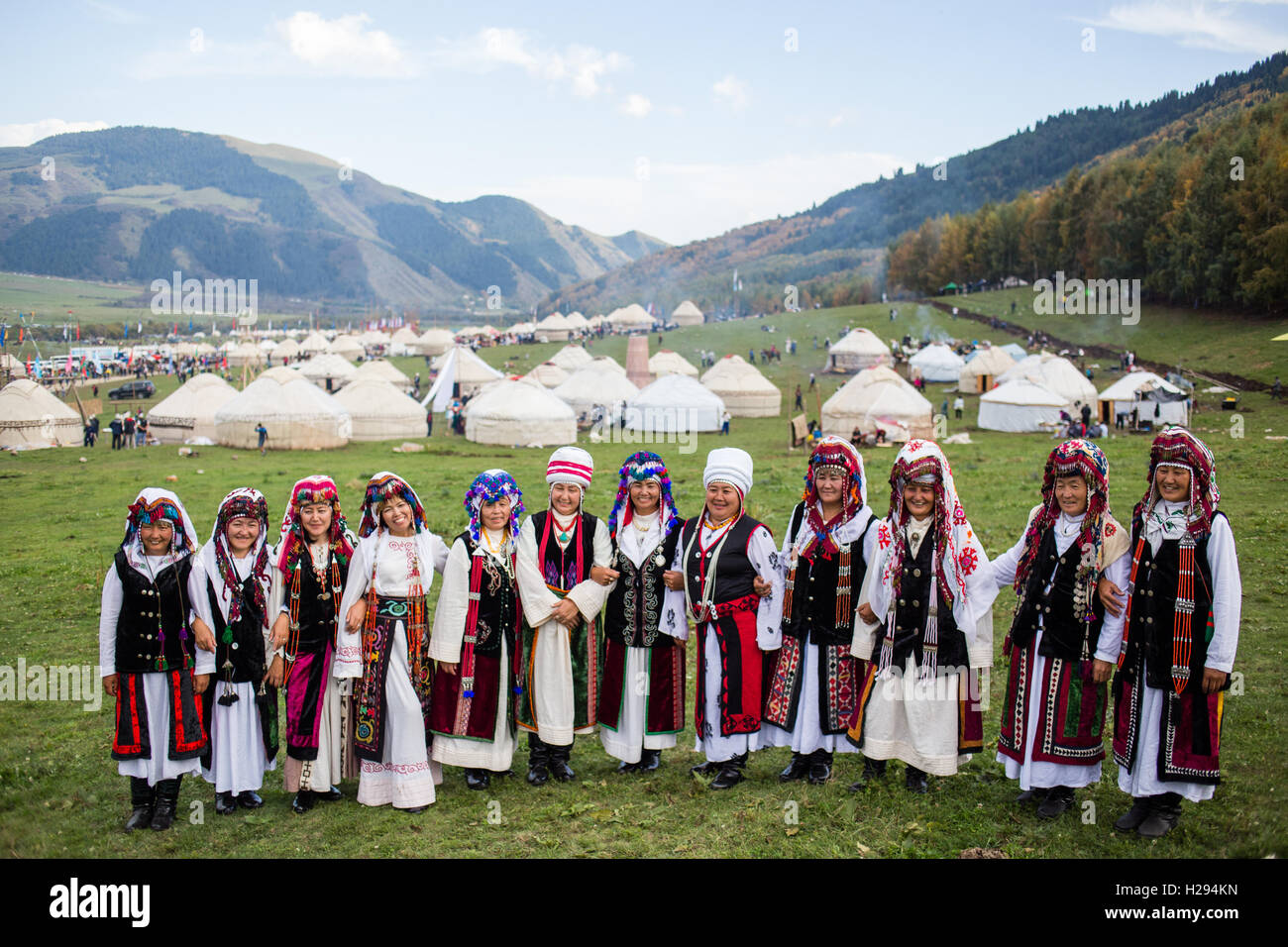 A Kyrgyz womens' singing group pose in costume after an informal performance at Jailoo Kyrchyn during the World Nomad Games in September 2016. Stock Photo