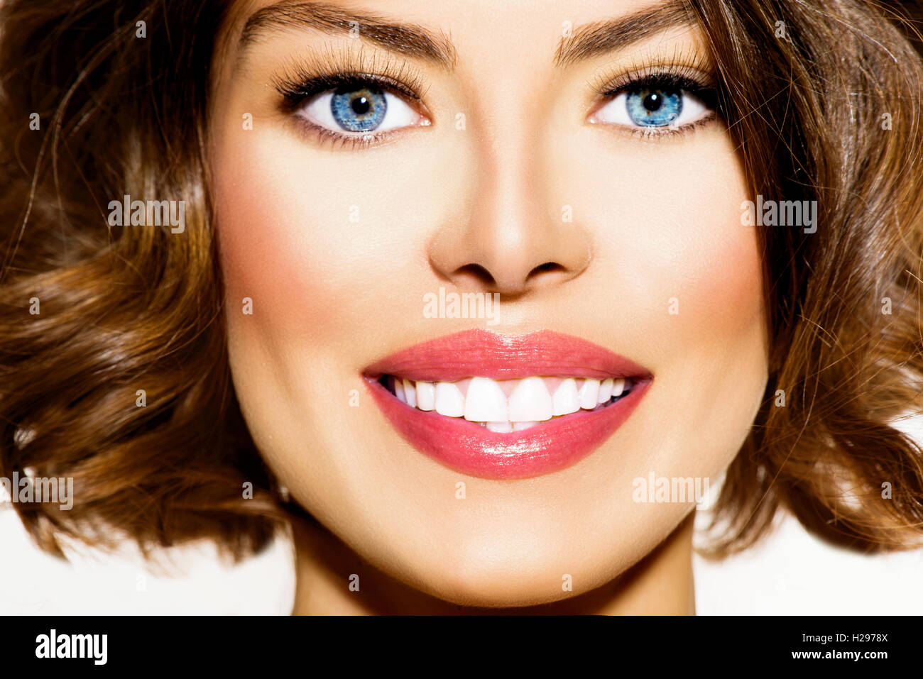 Teeth Whitening. Beautiful Smiling Young Woman Portrait closeup Stock Photo