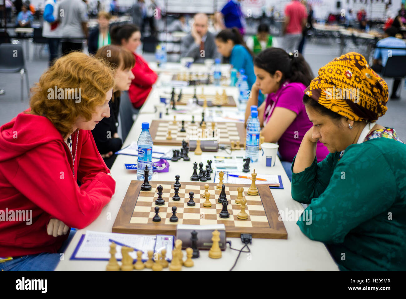 Eight-year-old Tim Wagner stands in front of ?his? poster and smiles during  the 2008 Chess Olympiad in Dresden, Germany, 15 November 2008. His is one  of the face represented during the advertisement