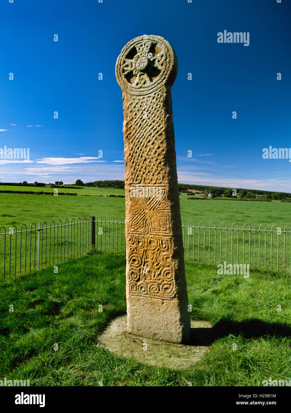 E face of Maen Achwyfan Cross, a late C10th disc-headed wayside cross still in its original position. Warrior figure & interlace Stock Photo