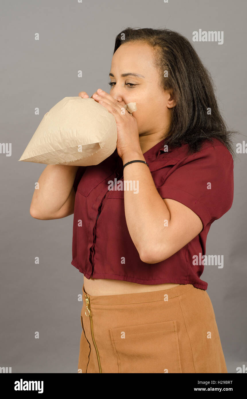 Blowing into paper bag hi-res stock photography and images - Alamy