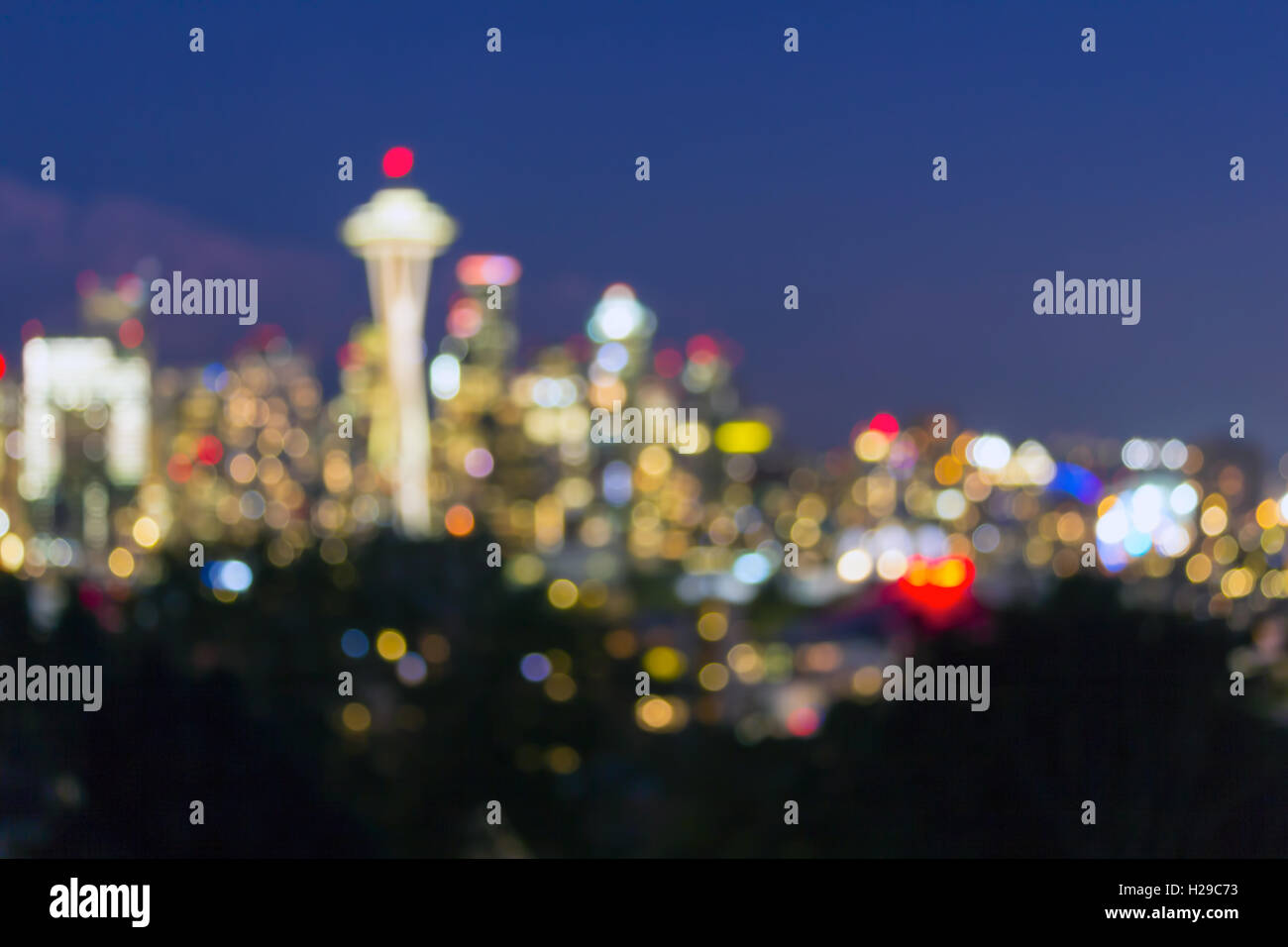 Seattle Washington city downtown skyline at dusk out of focus blurred bokeh city lights Stock Photo