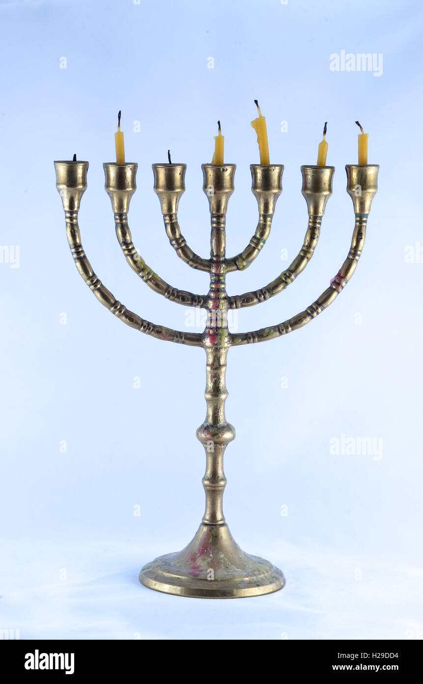 Old menorah with short candles. Clipping path included Stock Photo Alamy