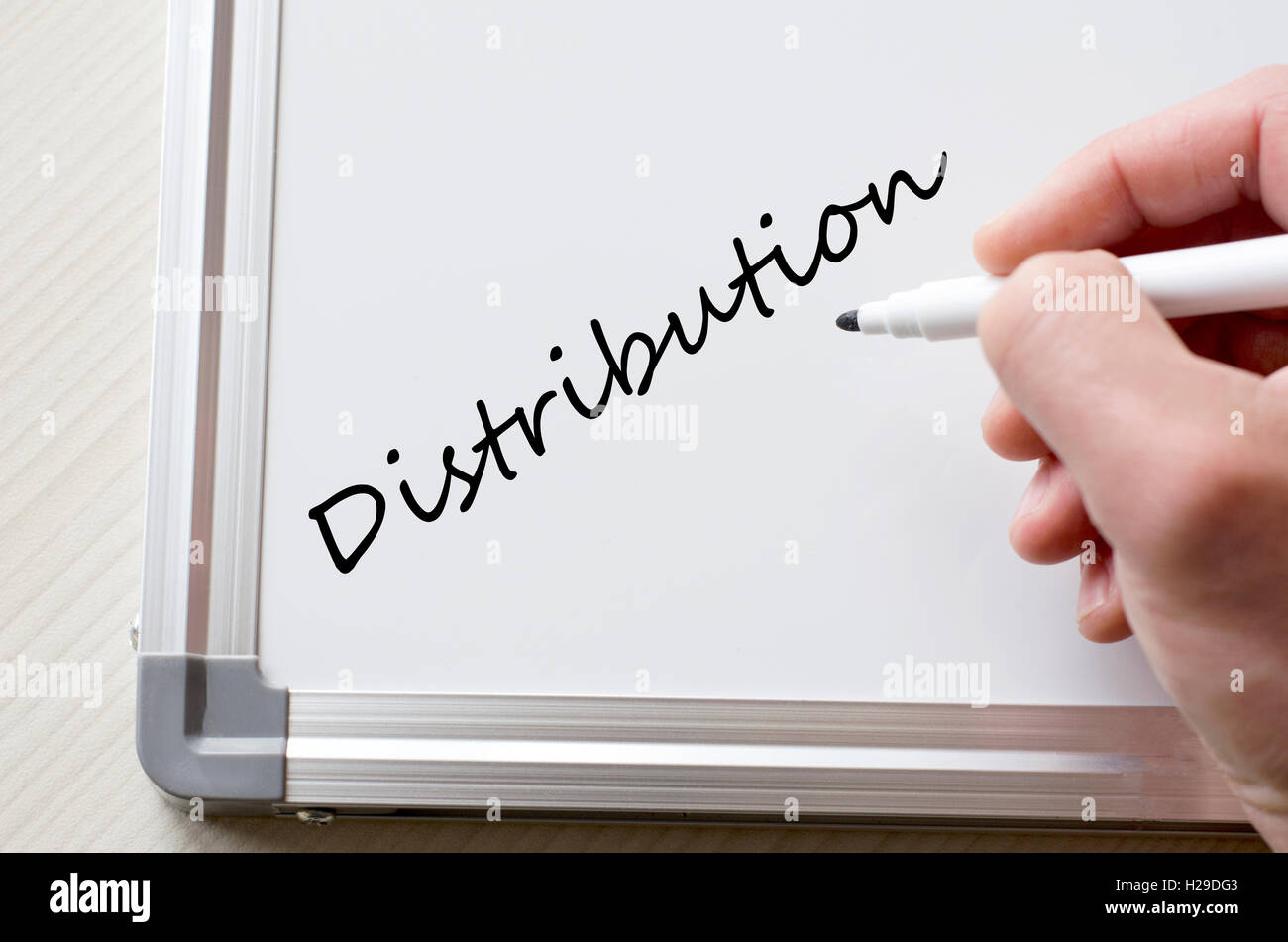 Human hand writing distribution on whiteboard Stock Photo - Alamy
