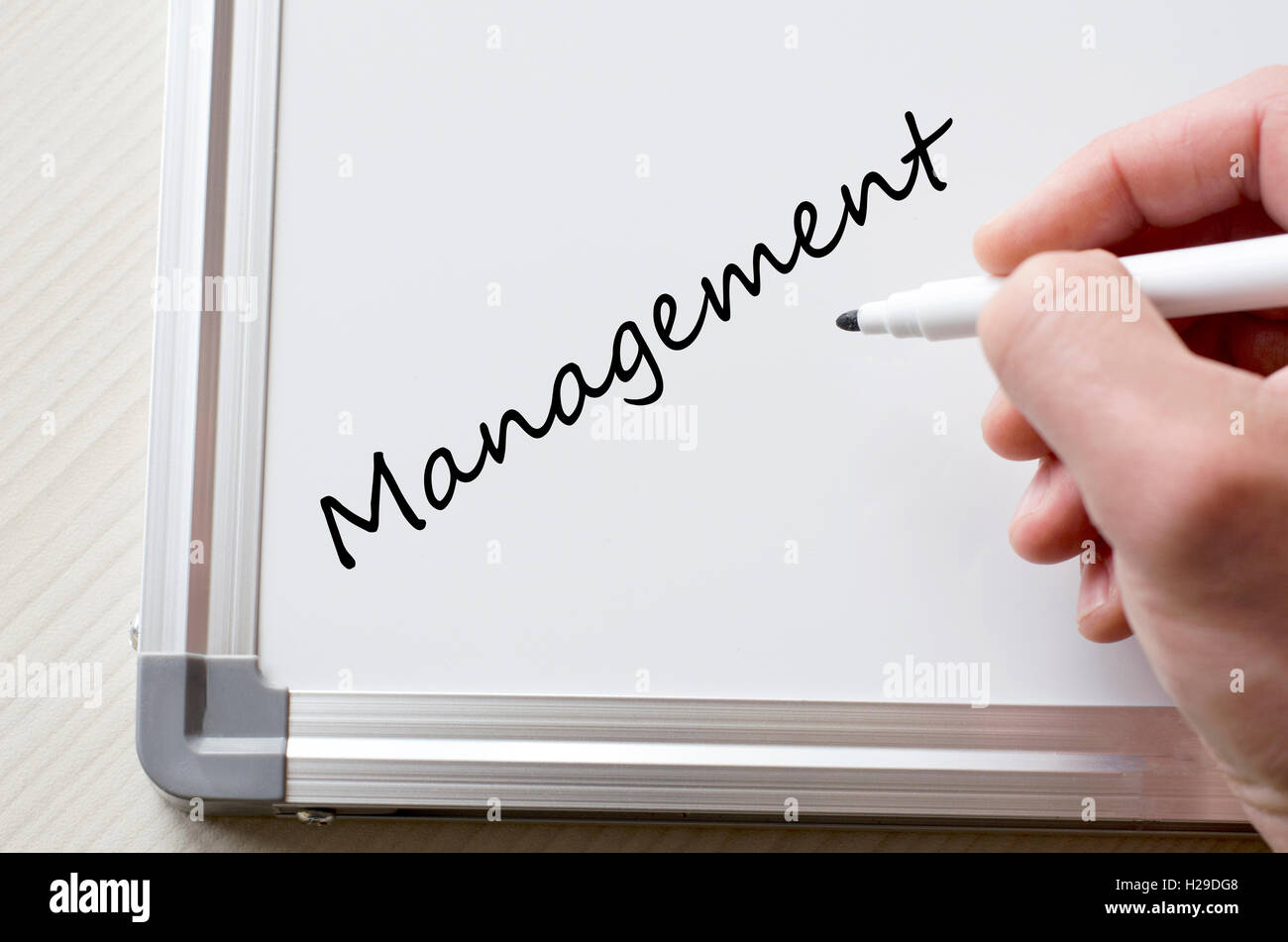 Human hand writing management on whiteboard Stock Photo - Alamy