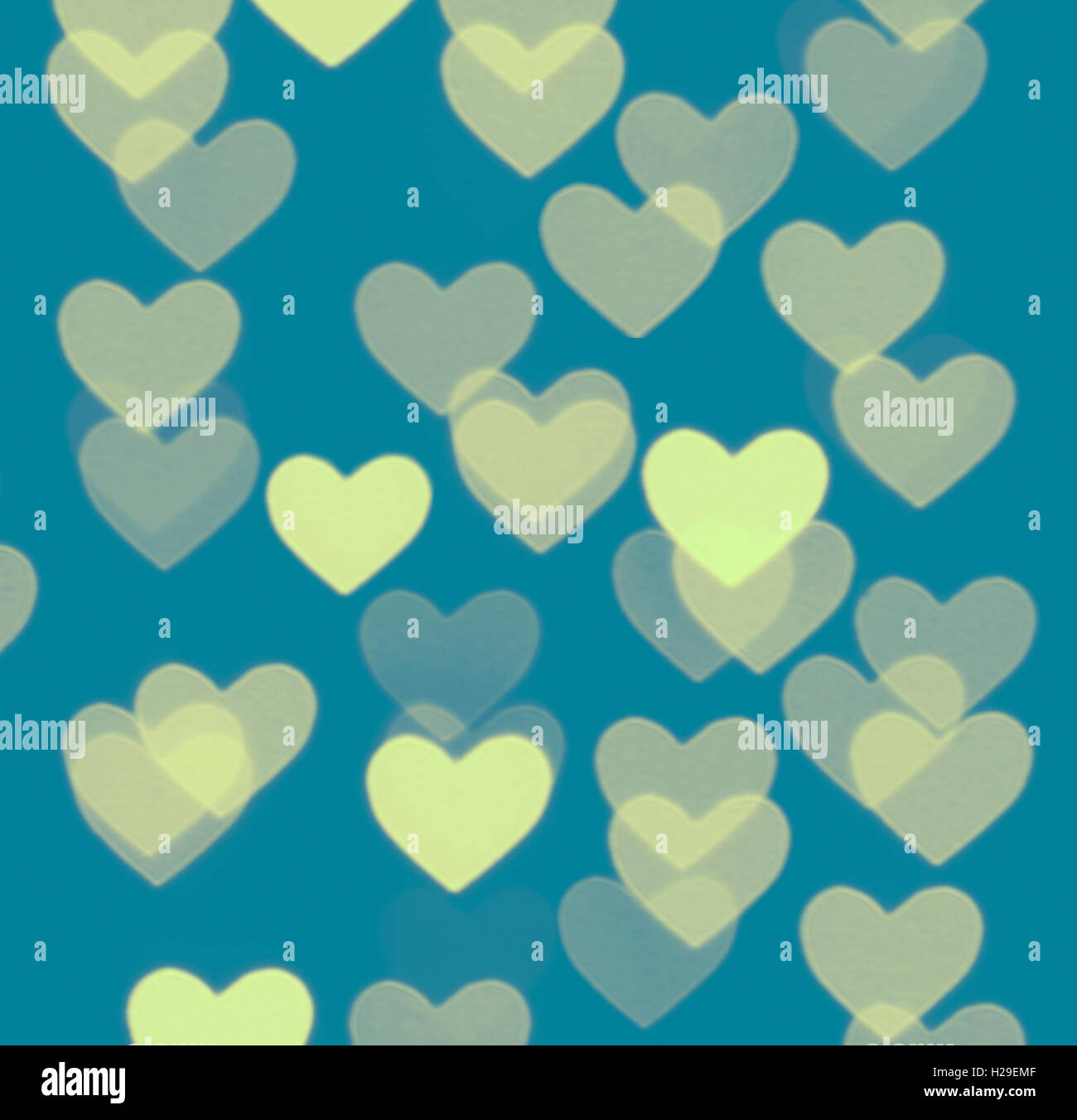 heart bokeh background, photo blurry objects, yellow on blue Stock Photo