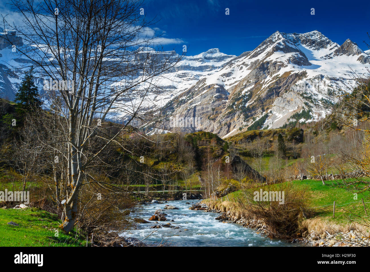 Snow-covered mountains and river Stock Photo - Alamy
